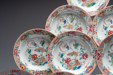 A set of 12 Chinese famille rose plates with squirrels among grapes and peonies, Qianlong