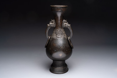 A large Chinese bronze 'hu' vase with luduan-form handles, Yuan