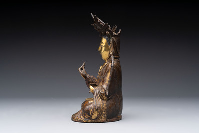 A Chinese parcel-gilt bronze Guanyin, Ming