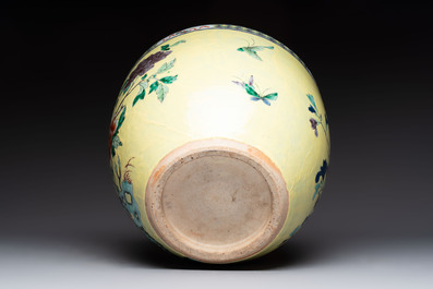 A Chinese famille rose yellow-ground 'pheasant and peony' scroll pot, 19th C.