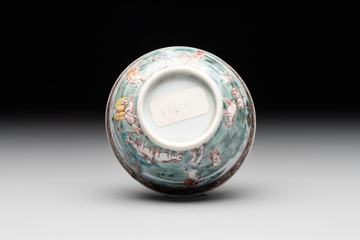 A fine Chinese famille rose 'apple pickers' cup and saucer, Yongzheng