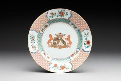 A Chinese famille rose armorial plate, a cup and a 'European subject' milk jug, Yongzheng/Qianlong