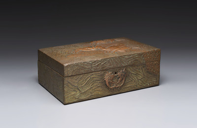 Alfred Daguet (Paris, 1875-1942): An Art Nouveau repouss&eacute; brass- and copper-mounted box with 'crabs' design and inset glass eyes, ca. 1900