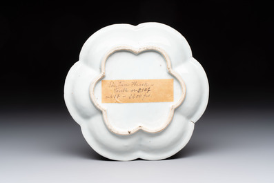 A Chinese famille rose moulded teapot and stand with floral design, Yongzheng/Qianlong