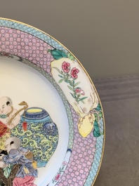 An extremely fine pair of Chinese famille rose ruby-back eggshell plates with a lady and playing boys, Yongzheng