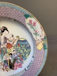 An extremely fine pair of Chinese famille rose ruby-back eggshell plates with a lady and playing boys, Yongzheng