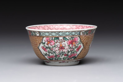 A fine Chinese gilt-decorated famille rose 'flower basket' cup and saucer, Yongzheng