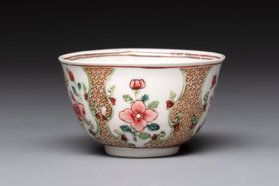 A fine Chinese gilt-decorated famille rose cup and saucer with floral design, Yongzheng