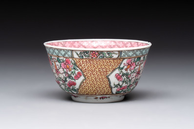 A fine Chinese gilt-decorated famille rose 'flower basket' cup and saucer, Yongzheng