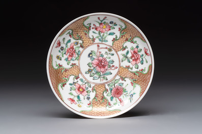 A fine Chinese gilt-decorated famille rose cup and saucer with floral design, Yongzheng