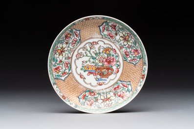 A fine Chinese gilt-decorated famille rose 'flower basket' cup and saucer, Yongzheng