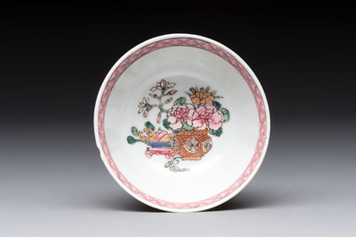 A fine Chinese gilt-decorated famille rose 'flower basket' cup and saucer, Yongzheng