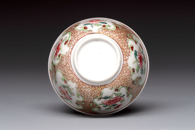 A fine Chinese gilt-decorated famille rose cup and saucer with floral design, Yongzheng