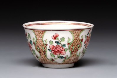 A fine Chinese gilt-decorated famille rose cup and saucer with floral design, Yongzheng