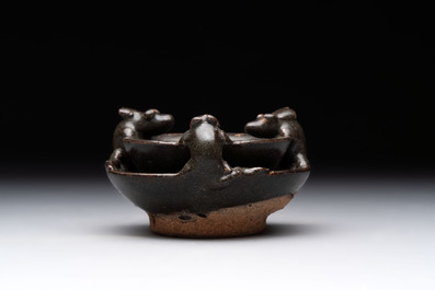 A rare Chinese black-glazed two-tier oil lamp with three rats, Ming