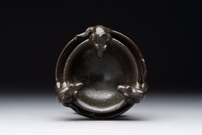 A rare Chinese black-glazed two-tier oil lamp with three rats, Ming
