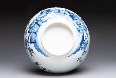 A Chinese blue and white punch bowl with a lady and two boys in a garden, Qianlong
