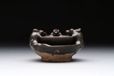 A rare Chinese black-glazed two-tier oil lamp with three rats, Ming