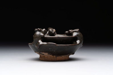 A rare Chinese black-glazed two-tier oil lamp with three rats, Ming