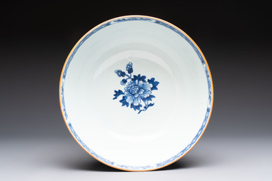 A Chinese blue and white punch bowl with a lady and two boys in a garden, Qianlong