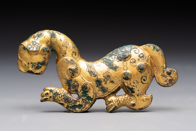 A rare Chinese gilt-bronze 'tiger' ornament, Han
