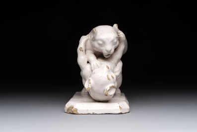 A rare white-glazed Delftware group of two fighting felines, early 18th C.