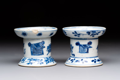 A pair of rare Chinese blue and white sanders with antiquities and floral design, Kangxi