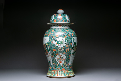 A very large Chinese famille verte 'warriors on horseback' vase and cover, 19th C.