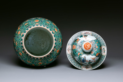 A very large Chinese famille verte 'warriors on horseback' vase and cover, 19th C.