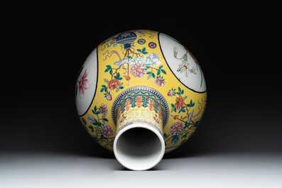 A large Chinese famille rose yellow-ground 'tianqiu ping' vase with flowers and antiquities, 19th C.