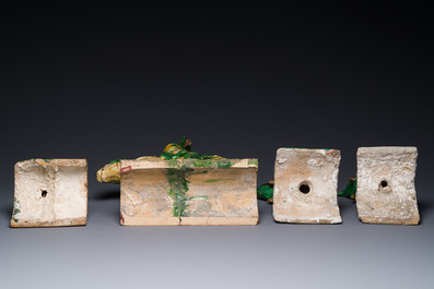 A pair of Chinese sancai-glazed roof tiles in the shape of fish, a warrior on horseback and a sage, Ming