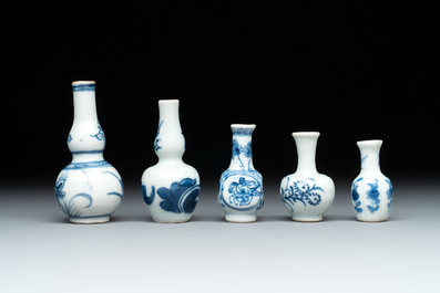 Ten Chinese blue and white miniature vases with figural and floral design, Kangxi