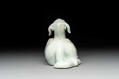 A pair of Chinese polychrome lions and a celadon-glazed goat, 20th C.