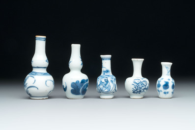 Ten Chinese blue and white miniature vases with figural and floral design, Kangxi