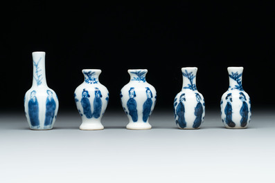 Ten Chinese blue and white miniature vases with figural and floral design, Kangxi