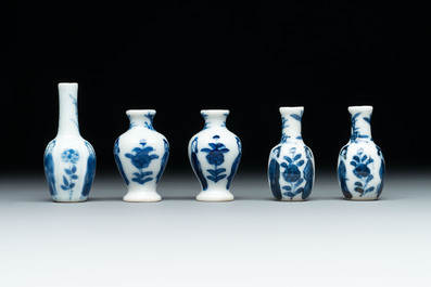 Ten Chinese blue and white miniature vases with figural and floral design, Kangxi