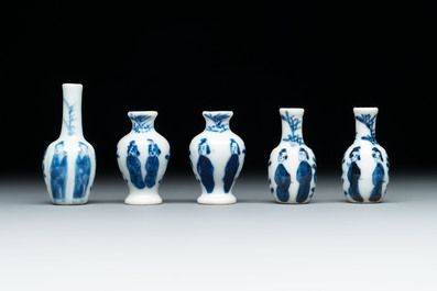 Ten Chinese blue and white miniature vases with figural and floral design, Kangxi