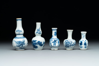Ten Chinese blue and white miniature vases with figural and floral design, Kangxi