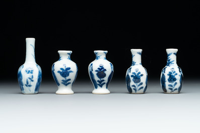 Ten Chinese blue and white miniature vases with figural and floral design, Kangxi