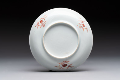 A set of six Chinese famille rose 'birds among flowering branches' cups and saucers, Yongzheng/Qianlong