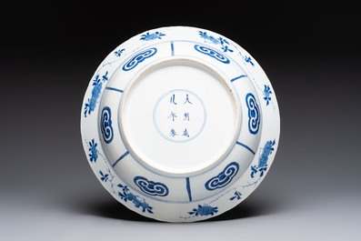 Three large Chinese blue and white 'hunting scene' deep dishes, Chenghua mark, Kangxi