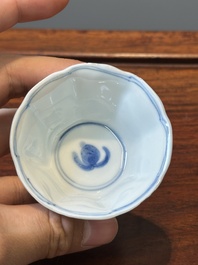 A set of six Chinese blue and white flower-shaped 'sanduo' cups and saucers, lingzhi mark, Kangxi