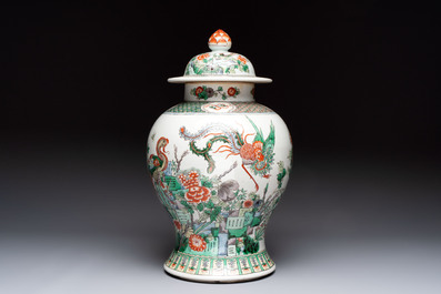 A Chinese famille verte 'phoenixes' vase and cover, 19th C.