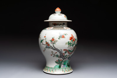 A Chinese famille verte 'phoenixes' vase and cover, 19th C.