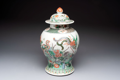 A Chinese famille verte 'phoenixes' vase and cover, 19th C.