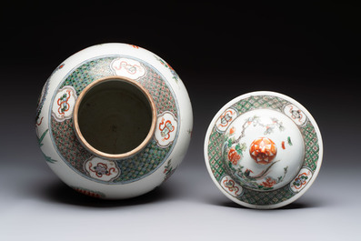 A Chinese famille verte 'phoenixes' vase and cover, 19th C.