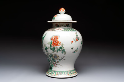 A Chinese famille verte 'phoenixes' vase and cover, 19th C.