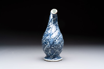 A Chinese blue and white double-spouted swirling-lobed cruet, Kangxi