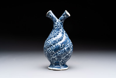 A Chinese blue and white double-spouted swirling-lobed cruet, Kangxi