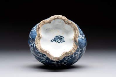 A Chinese blue and white double-spouted swirling-lobed cruet, Kangxi